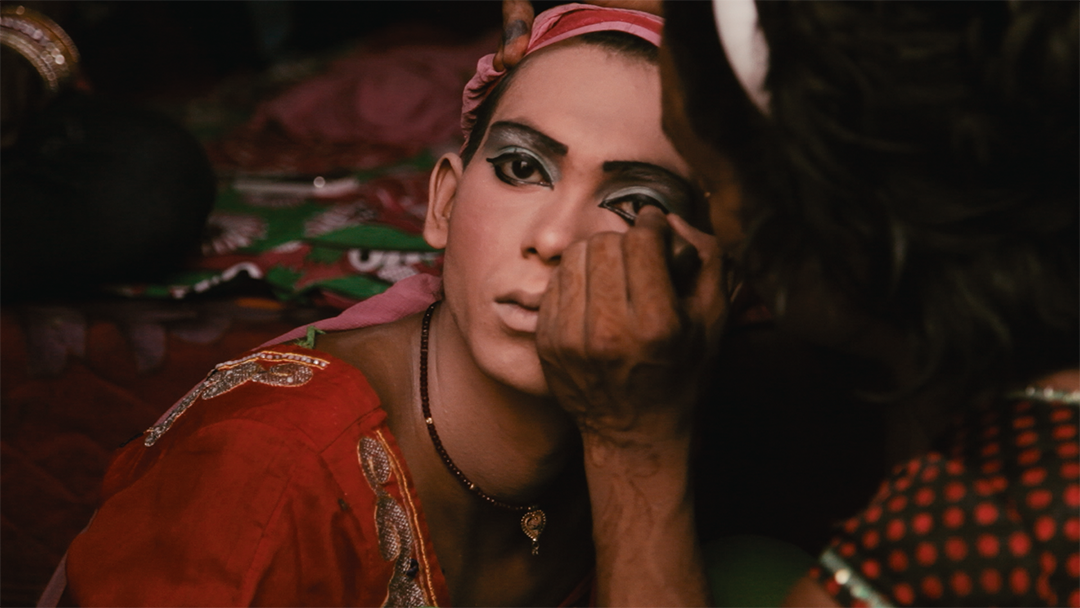 A poignant scene from the documentary, showing Rudrani Chettri in action, mentoring aspiring trans models in a vibrant, supportive setting.